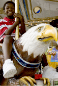A Boy Riding the Carousel a boy riding the carousel